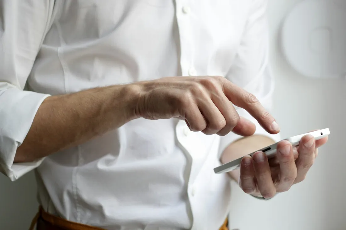 Hands setting up a timer plan on an iPhone